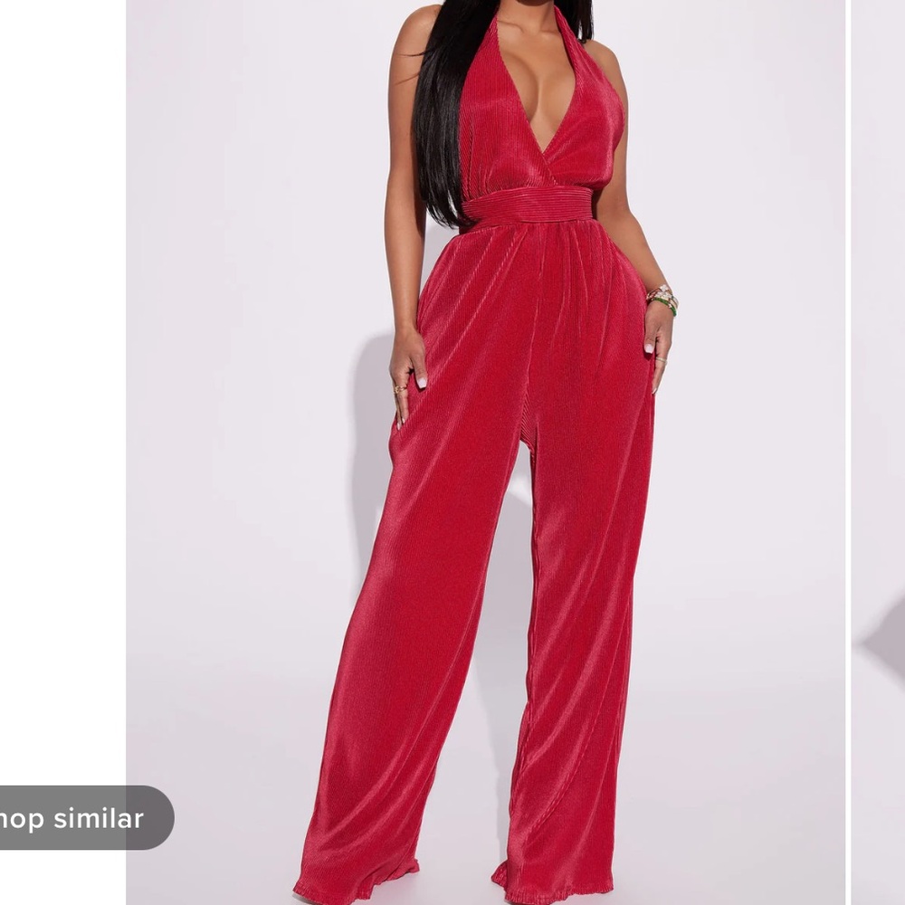 Red jumpsuit. Size small. Halter top. V neck line. Backless. Never worn.